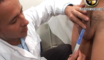 The campus doctor measures the Latino boy's uncut cock